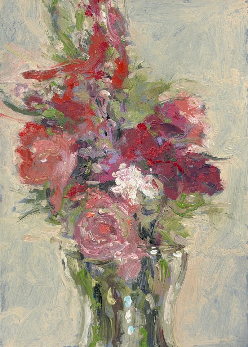 Pink and purple flowers in a glass vase