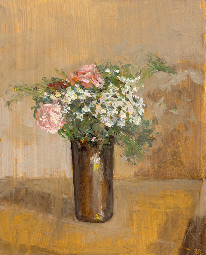 Pink and white flowers in a bronze vase