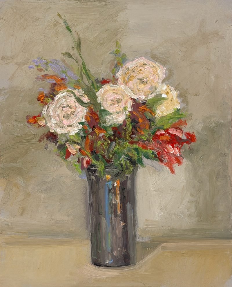Pale roses in a dark vase